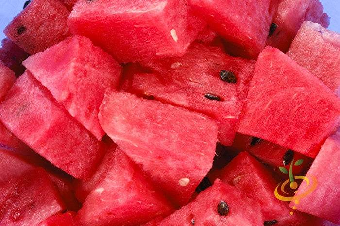Close-up of bright red, juicy Watermelon Black Diamond cubes with seeds