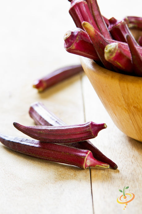 Red Burgundy okra seeds from SeedsNow, showing small seed packets with vibrant red-burgundy colored okra seed illustrations.