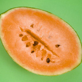 Watermelon Tendersweet orange-flesh seeds from SeedsNow, shown in a close-up image of seed packaging and fresh watermelon slices